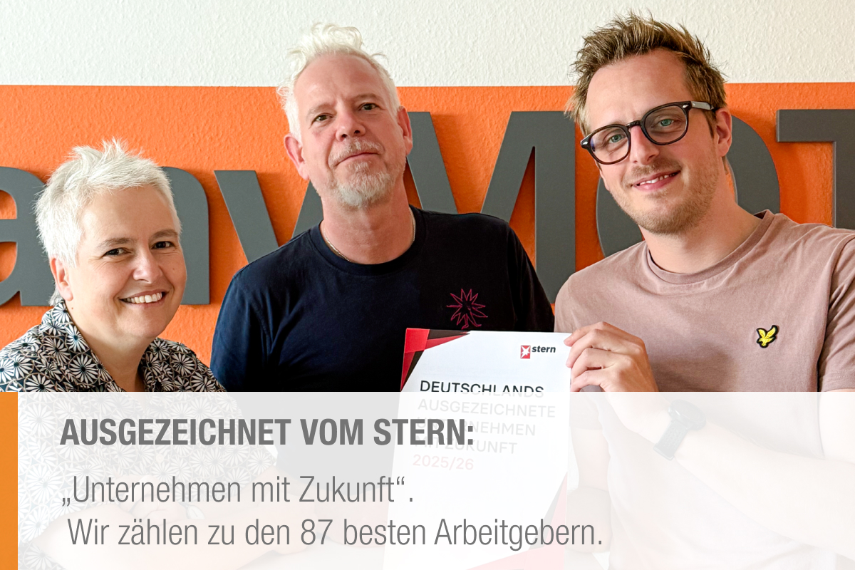 Mitarbeiter zeigen STERN-Auszeichnung